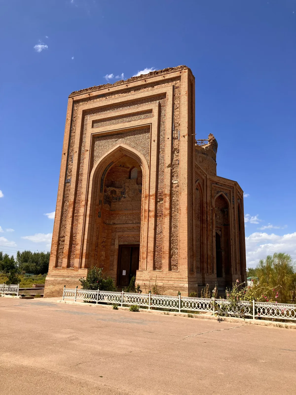 Ancient brick mausoleum of Sultan Tekesh with a high portal in the Koneurgench historical reserve